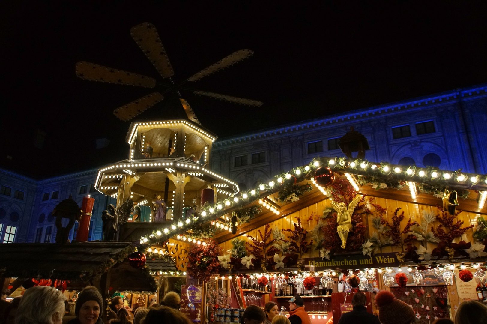 Christmas Market Munich - people standing at a Christmas market stall