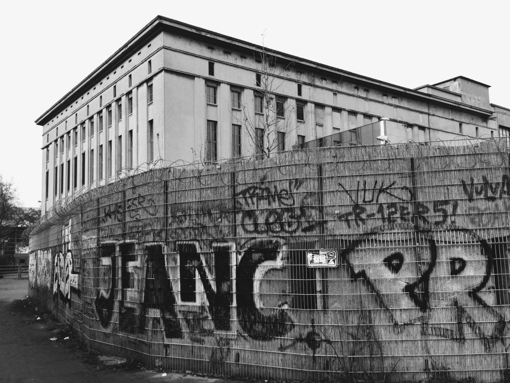 Graffiti on a wall and the Berghain on the background