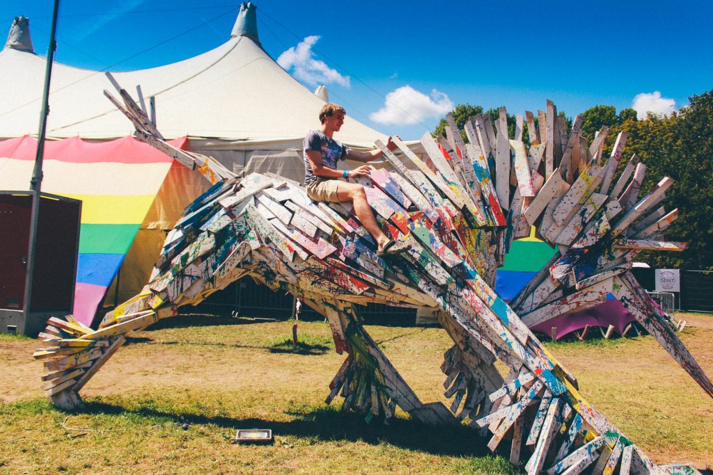 Sziget Festival Budapest: a festival goer riding a wooden horse