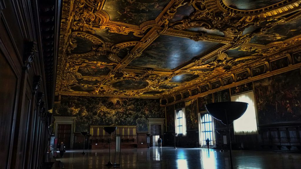 Ornate golden ceiling and grand hall interior in Doge’s Palace, Venice