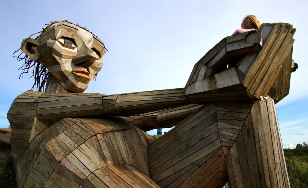 Copenhagen with kids: a giant wooden man sculpture, part of The Six Forgotten Giants