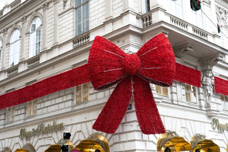 Giant red light ribbon wrapped on a building