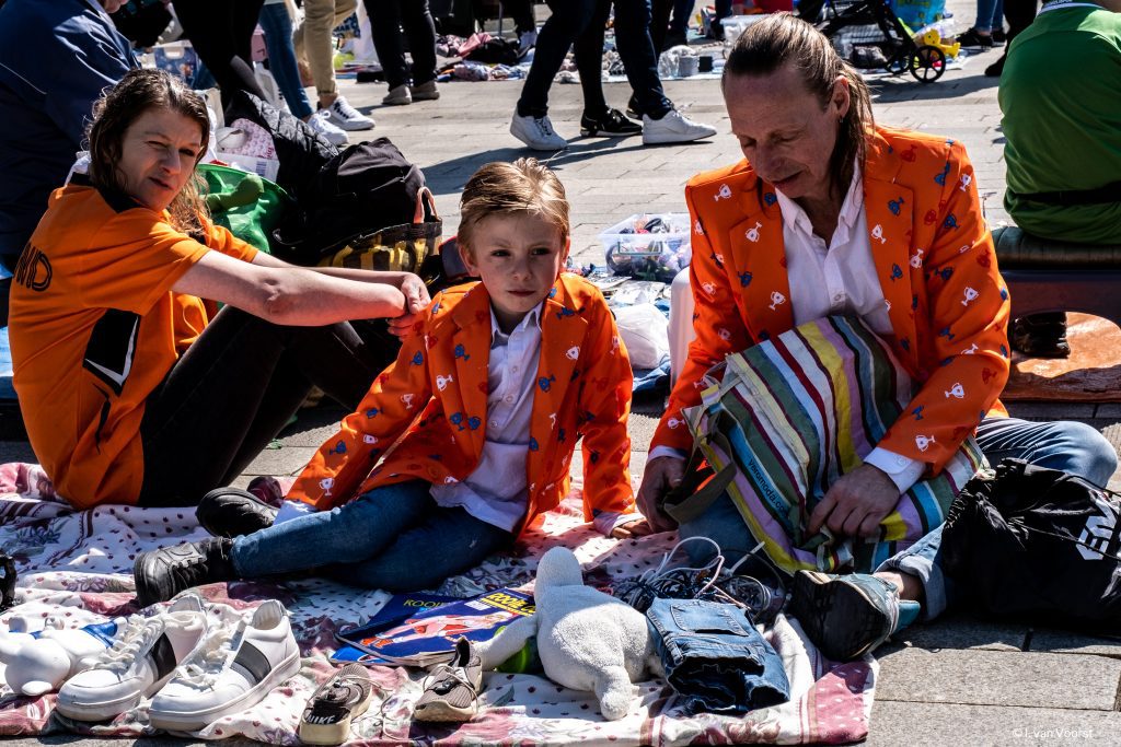 King's day Netherlands: a family at the King's day flea market