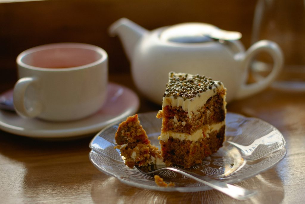 A slice of vegan carrot cake and tea 